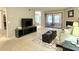 Spacious living room with a fireplace and access to a sunroom at 224 Seasons Pkwy, Norcross, GA 30093