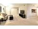 Open concept living room with kitchen view and neutral decor at 224 Seasons Pkwy, Norcross, GA 30093