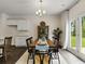 Kitchen dining area with a wooden table and access to the backyard at 8232 Walnut Hall Dr, Fairburn, GA 30213