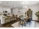 Open concept kitchen with island, granite countertops, and white cabinets at 8232 Walnut Hall Dr, Fairburn, GA 30213