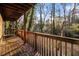 Wooden deck with railing offering wooded area views at 3284 Huntwood Drive, Decatur, GA 30034