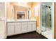 Bathroom featuring a double sink vanity, large mirror, and glass enclosed shower at 3284 Huntwood Dr, Decatur, GA 30034