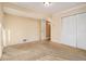 Bedroom with neutral carpet and a closet with bi-fold doors at 3284 Huntwood Dr, Decatur, GA 30034