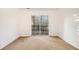 Bedroom featuring a large sliding glass door and neutral carpet at 3284 Huntwood Dr, Decatur, GA 30034