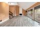 Bright living room with fireplace, gray laminate floors and sliding doors to the outdoors at 3284 Huntwood Dr, Decatur, GA 30034