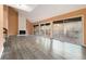Bright living room with fireplace, gray laminate floors and sliding doors to the outdoors at 3284 Huntwood Dr, Decatur, GA 30034
