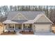Craftsman style home with gray siding, covered porch, and two-car garage at 8980 Callaway Dr, Winston, GA 30187