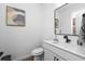 Modern powder room with white vanity and black fixtures at 1038 Brookglynn Trce, Decatur, GA 30032