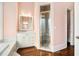 Bathroom features a shower, vanity, and hardwood floors at 159 Cedar Creek Rd, Cartersville, GA 30121