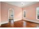 Light pink bedroom with hardwood floors and access to another room at 159 Cedar Creek Rd, Cartersville, GA 30121