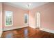 Spacious bedroom with hardwood floors and an arched doorway at 159 Cedar Creek Rd, Cartersville, GA 30121