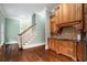 Kitchen features light wood cabinets, granite countertops, and a staircase view at 159 Cedar Creek Rd, Cartersville, GA 30121