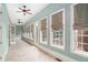 Bright sunroom with tiled floors and multiple windows offering ample natural light at 159 Cedar Creek Rd, Cartersville, GA 30121