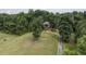 House with long driveway and beautiful landscaping at 416 Spring Place Ne Rd, White, GA 30184