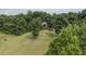 House surrounded by trees on a large lot at 416 Spring Place Ne Rd, White, GA 30184
