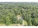 House nestled in a wooded area, with a long driveway at 416 Spring Place Ne Rd, White, GA 30184