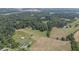 Aerial view of property showing home, barn and pond at 416 Spring Place Ne Rd, White, GA 30184