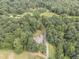 Spectacular aerial view of a house surrounded by lush greenery at 416 Spring Place Ne Rd, White, GA 30184