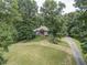 Ranch home on a wooded lot with a long driveway at 416 Spring Place Ne Rd, White, GA 30184