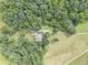 Home nestled among trees with a long driveway at 416 Spring Place Ne Rd, White, GA 30184