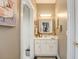 Small bathroom with white vanity and a mirrored medicine cabinet at 416 Spring Place Ne Rd, White, GA 30184