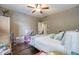 Bedroom with hardwood floors, a bed and a ceiling fan at 416 Spring Place Ne Rd, White, GA 30184
