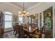 Formal dining room with a wooden table, chandelier, and Gathering photos at 416 Spring Place Ne Rd, White, GA 30184