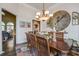 Bright dining room with a large table, chandelier, and views into adjacent rooms at 416 Spring Place Ne Rd, White, GA 30184