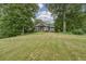 Beautiful home nestled on a spacious lot with lush landscaping at 416 Spring Place Ne Rd, White, GA 30184