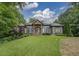 Stunning two-story home with a manicured lawn and charming facade at 416 Spring Place Ne Rd, White, GA 30184