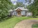 Beautiful house with gray siding, landscaping, and walkway at 416 Spring Place Ne Rd, White, GA 30184