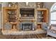 Stone fireplace with built-in shelving and wood accents at 416 Spring Place Ne Rd, White, GA 30184