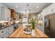 Large kitchen island with butcher block countertops and farmhouse style at 416 Spring Place Ne Rd, White, GA 30184
