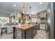 Spacious kitchen with island, stainless steel appliances, and custom cabinetry at 416 Spring Place Ne Rd, White, GA 30184