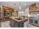 Eat-in kitchen with a large island, stainless steel appliances, and farm sink at 416 Spring Place Ne Rd, White, GA 30184