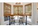 Charming kitchen nook with window seating and built-in bench at 416 Spring Place Ne Rd, White, GA 30184