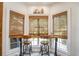 Charming kitchen nook with window seating and built-in bench at 416 Spring Place Ne Rd, White, GA 30184