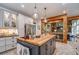 Open concept kitchen features a large island and breakfast bar at 416 Spring Place Ne Rd, White, GA 30184