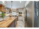 Modern kitchen with stainless steel appliances and custom cabinetry at 416 Spring Place Ne Rd, White, GA 30184