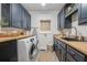 Functional laundry room with washer, dryer, and custom cabinetry at 416 Spring Place Ne Rd, White, GA 30184