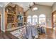 Large living room with stone fireplace, hardwood floors, and multiple seating areas at 416 Spring Place Ne Rd, White, GA 30184