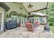 Relaxing stone patio with seating area, grill, and fire pit at 416 Spring Place Ne Rd, White, GA 30184