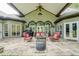 Covered patio perfect for outdoor entertaining with a fire pit and seating at 416 Spring Place Ne Rd, White, GA 30184