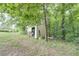 Functional storage shed tucked away in the woods at 416 Spring Place Ne Rd, White, GA 30184