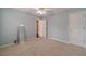 Spacious bedroom with plush carpet and view into hallway at 814 Sunny Field Ln, Lawrenceville, GA 30043