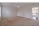 Bright bedroom featuring plush carpet, a ceiling fan, and natural light at 814 Sunny Field Ln, Lawrenceville, GA 30043