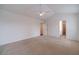 Spacious bedroom with neutral carpet, ceiling fan, and ensuite bathroom access at 814 Sunny Field Ln, Lawrenceville, GA 30043