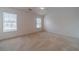 Large bedroom with vaulted ceiling, fan, and two sunny windows at 814 Sunny Field Ln, Lawrenceville, GA 30043