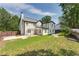 View of the home's rear exterior showcasing the patio and spacious backyard at 814 Sunny Field Ln, Lawrenceville, GA 30043