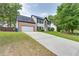 Two-story house with driveway and mature trees at 814 Sunny Field Ln, Lawrenceville, GA 30043